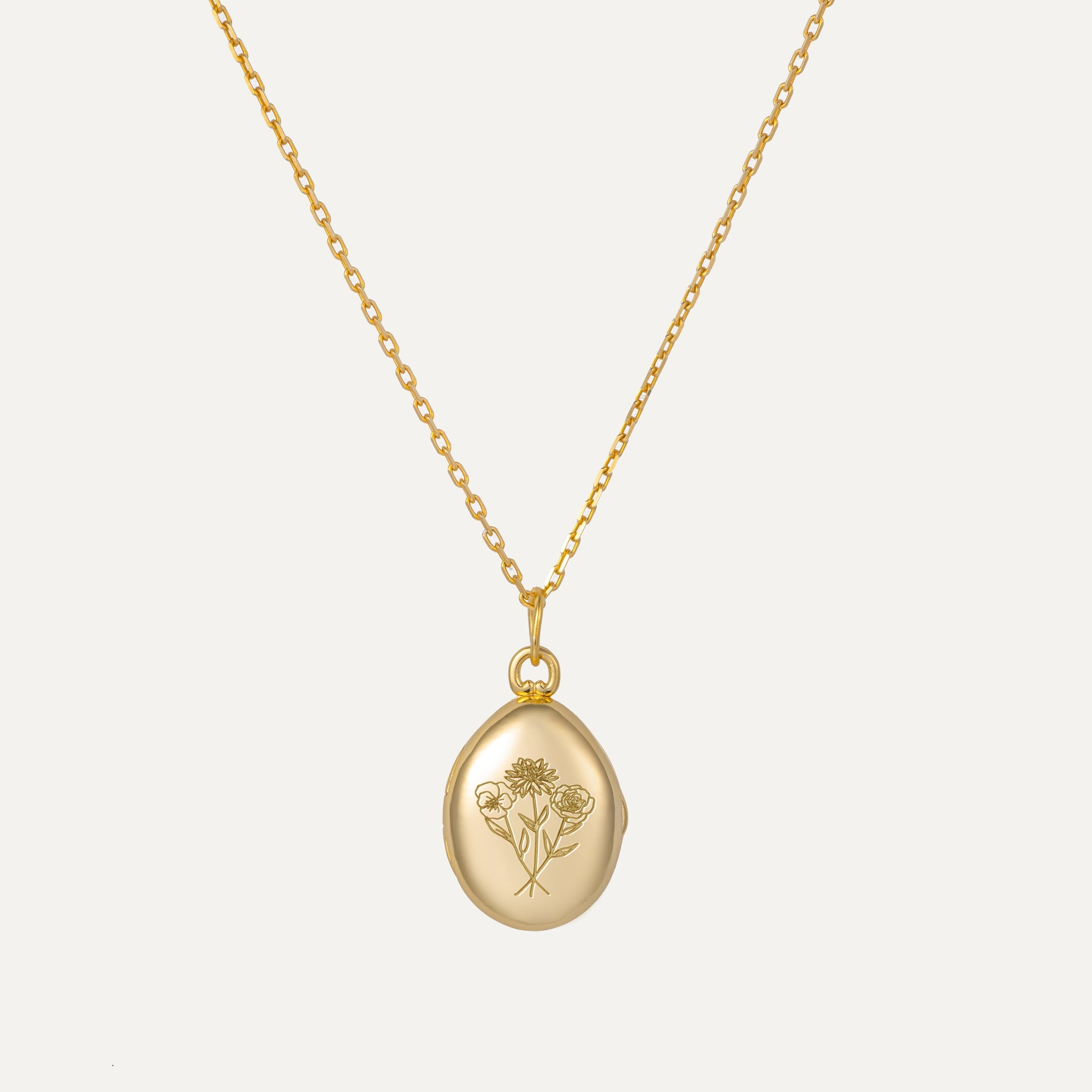 Birth Flower Engraved Oval Locket Necklace featured in Birth Flowers and the Language of Love: How to Choose the Perfect Flower for Every Relationship