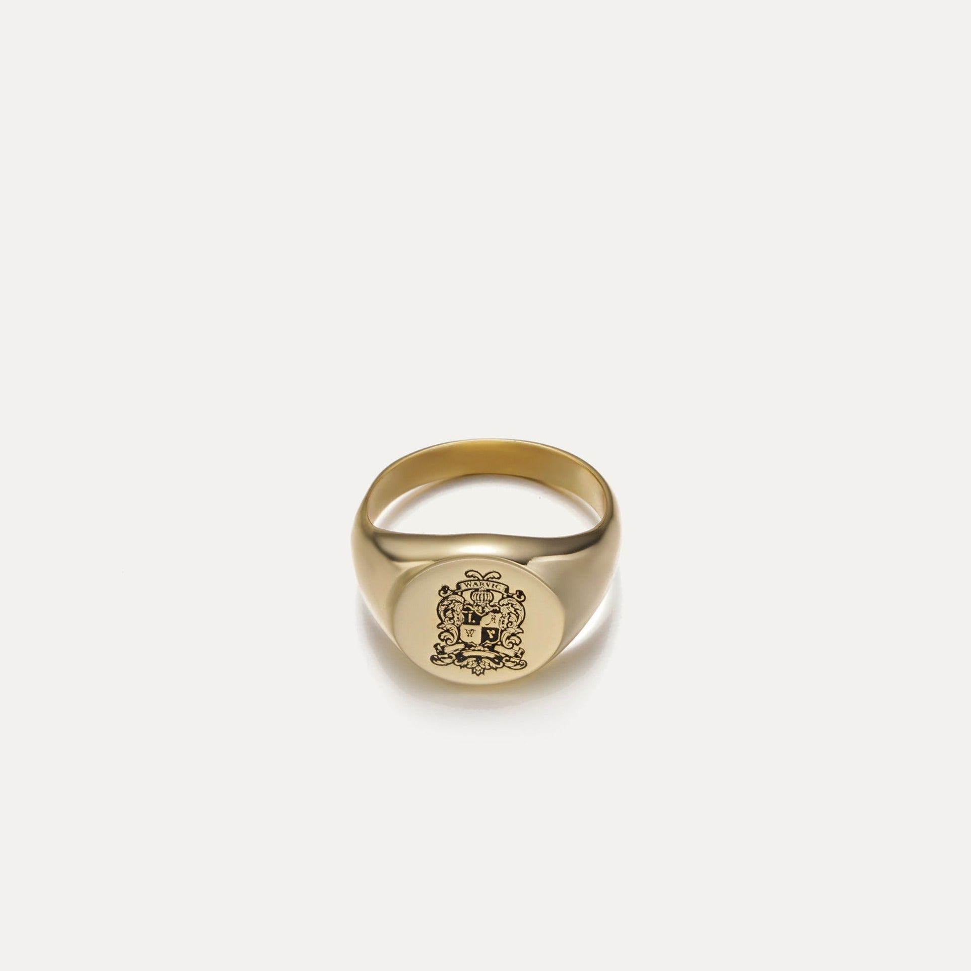 Custom family crest signet ring with engraved heraldic artwork