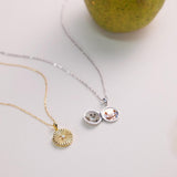 Two necklaces on a light surface with a blurred background